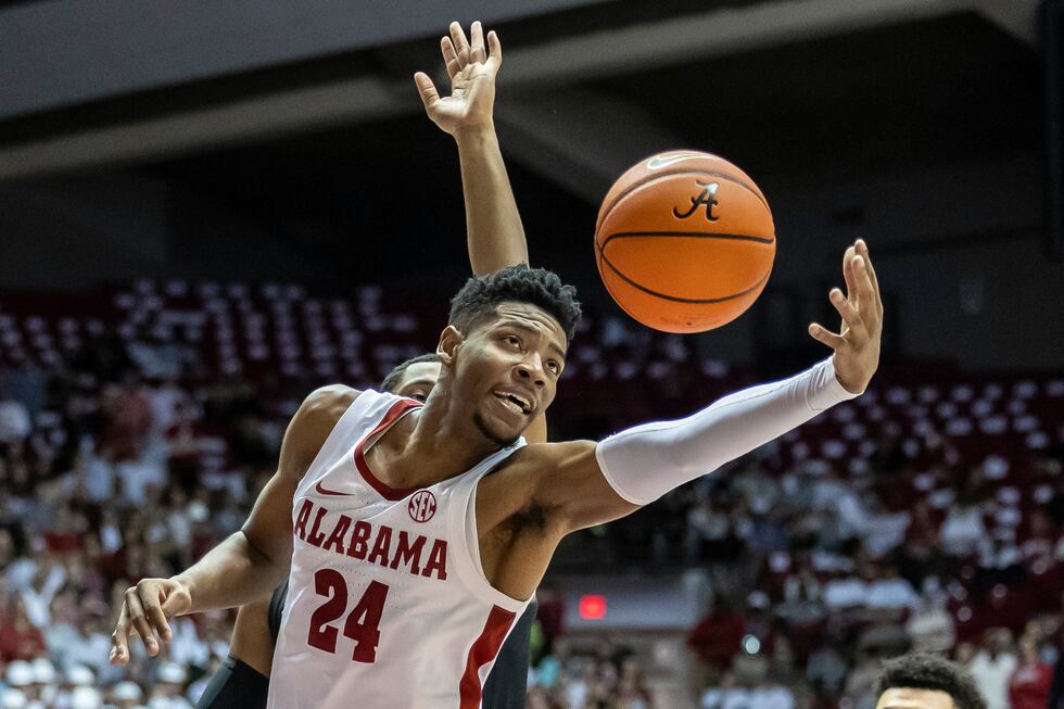 FILE - Alabama forward Brandon Miller (24) reaches for a rebound against Vanderbilt during the...