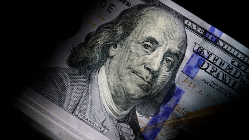 File - The likeness of Benjamin Franklin is seen on U.S. $100 bills, Thursday, July 14, 2022,...