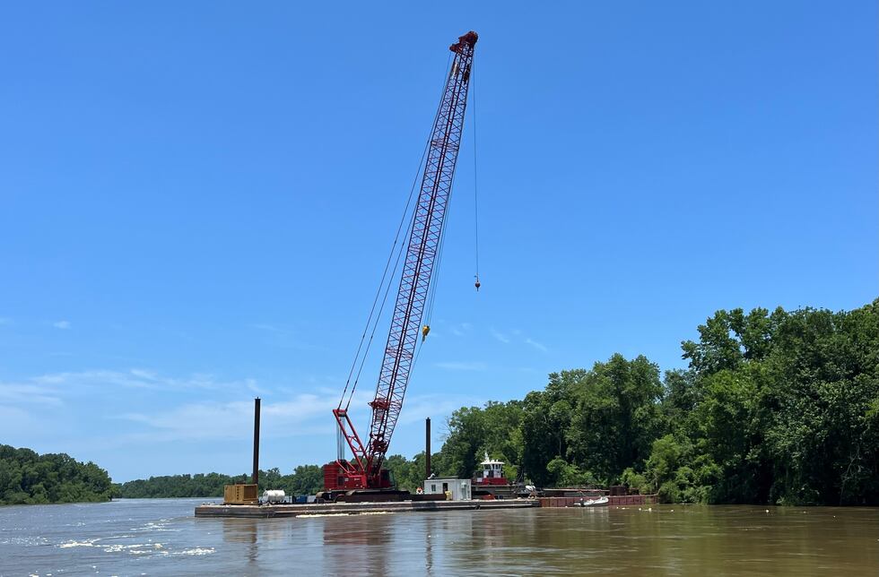 Barge on Alabama River marks spot where tugboat sank during storm