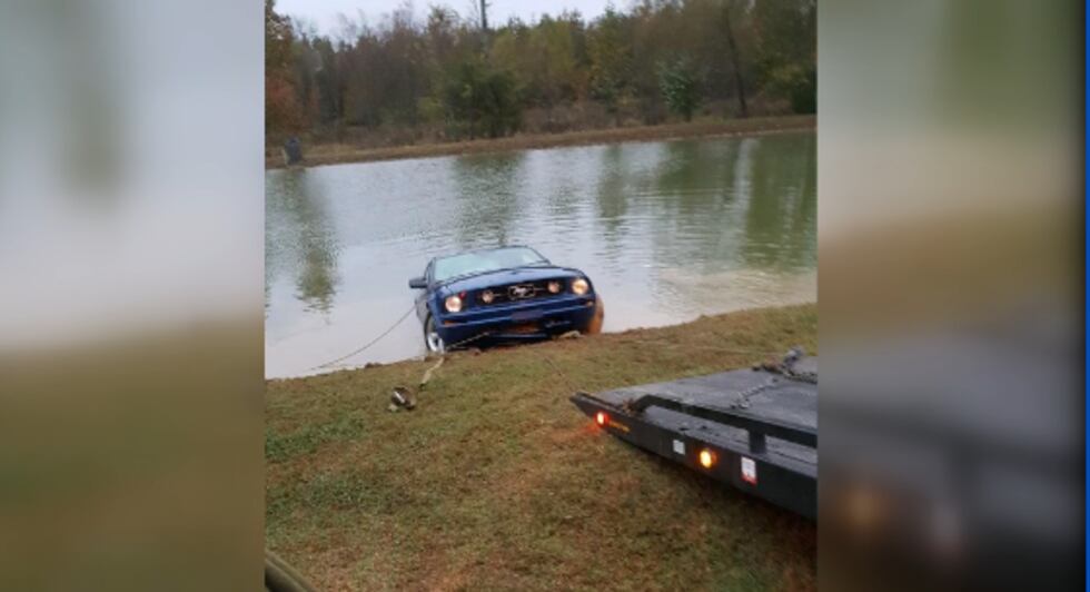 Nearby construction workers pulled a woman from her sinking car in a pond near Elkmont on...