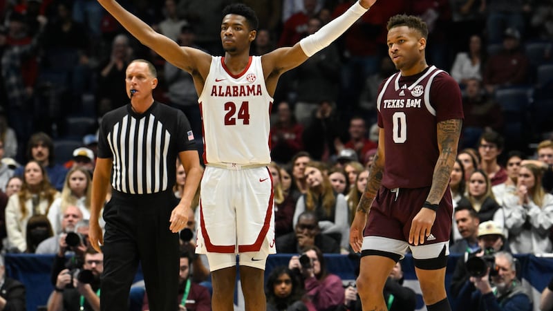 Alabama forward Brandon Miller (24) reacts as Texas A&M guard Dexter Dennis (0) looks on in...