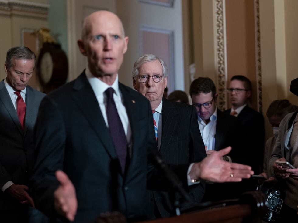 FILE — Sen. Rick Scott, R-Fla., speaks as Senate Minority Leader Mitch McConnell, R-Ky.,...