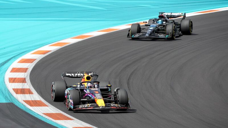 Max Verstappen (1) leads George Russell (63) through a turn during the Formula One Miami Grand...