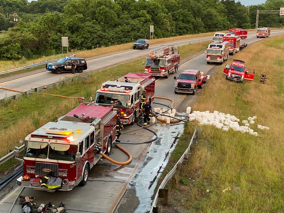 An 18-wheeler overturned and caught fire Thursday morning, blocking lanes of Interstate 65...
