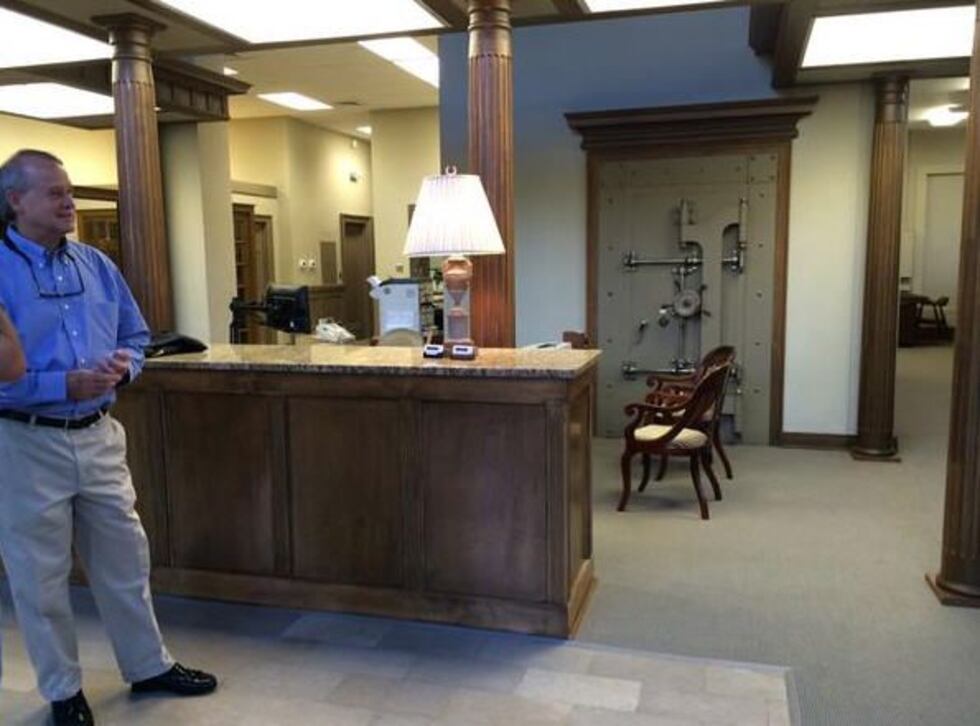 Inside the offices of Poole & Poole with the old bank vault seen in the background. (Source:...