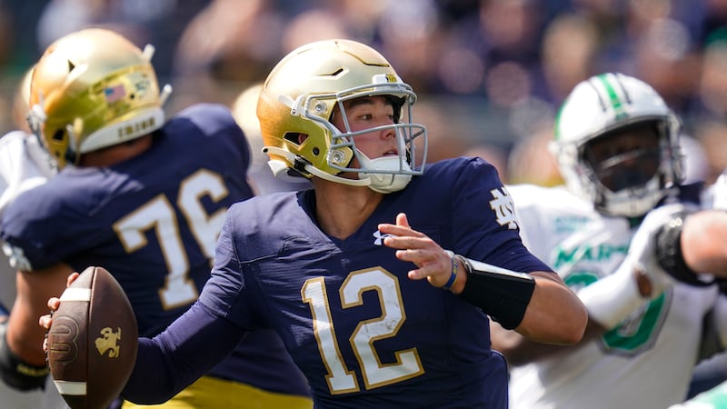 Notre Dame quarterback Tyler Buchner (12) throws against Marshall during the first half of an...