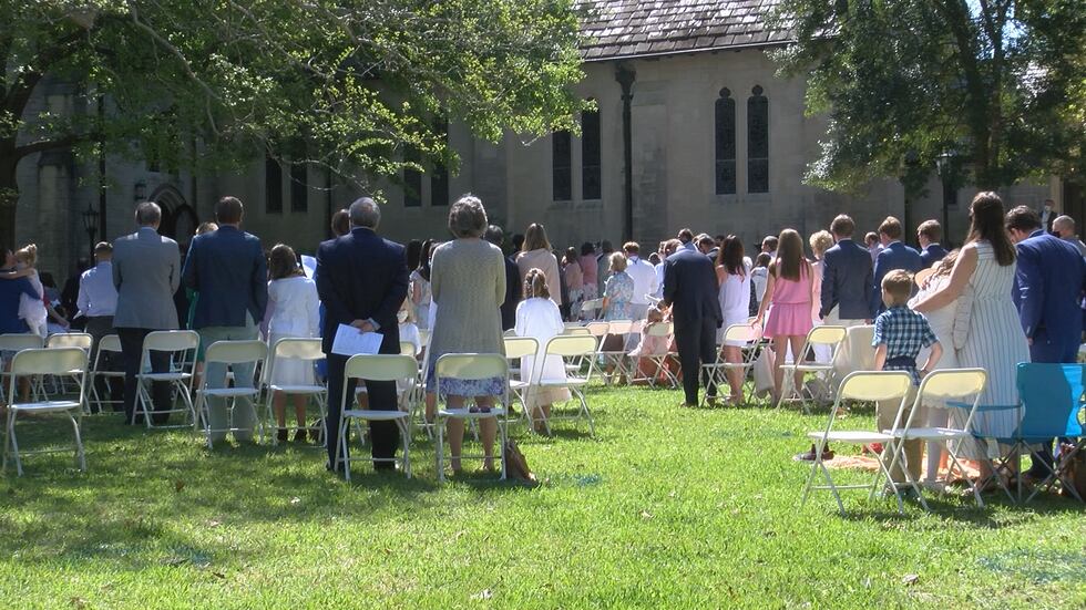 Family's take part in Church of the Ascension's outdoor 11:00 a.m. Easter Sunday service.