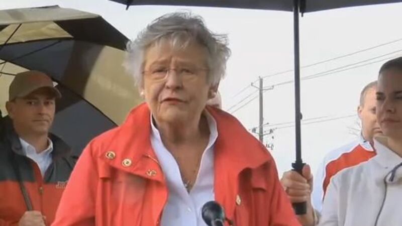 Gov. Kay Ivey addresses the media at Jacksonville State University during a tour of tornado...