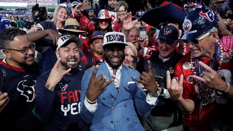 Alabama linebacker Will Anderson Jr. celebrates with fans after being chosen by the Houston...