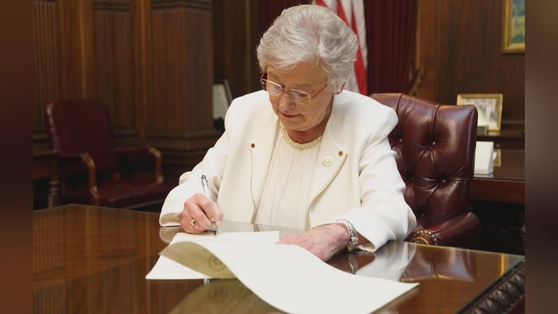 2021 file photo of Gov. Kay Ivey signing documents (Source: State of Alabama/Governor's Office)