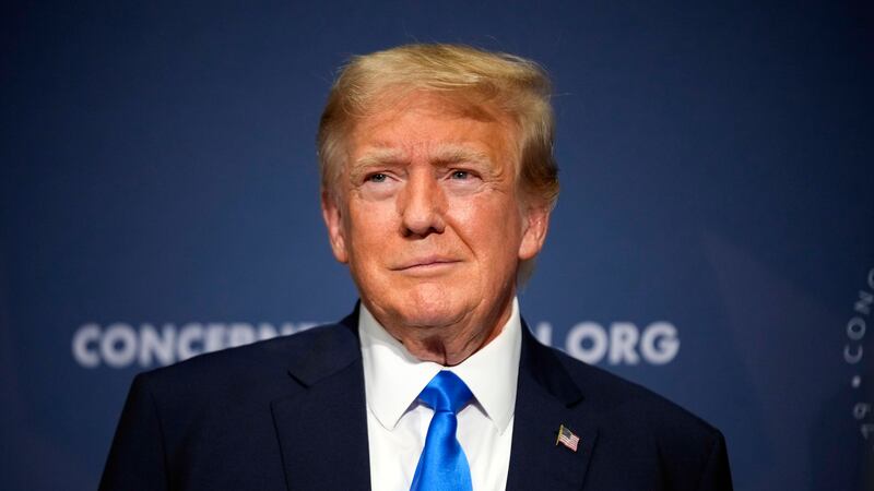 FILE - Former President Donald Trump stands on stage before speaking at a Concerned Women for...